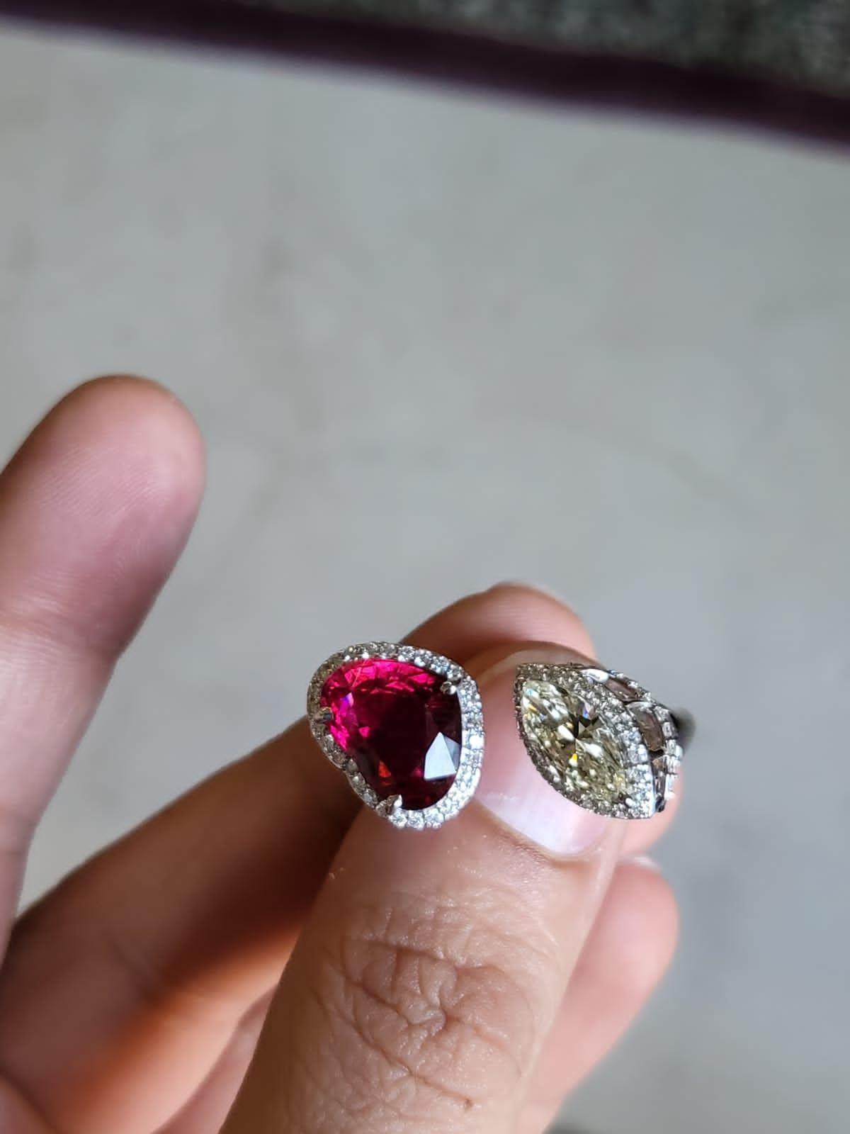 A very gorgeous ans of a kind, Rubellite Engagement Ring set in 18K White Gold & Diamonds. The weight of the heart shaped Rubellite is 4.36 carats. The weight of the Marquise Diamond is 1.05 carats. Other Diamonds weight is 0.75 carats. Net Gold