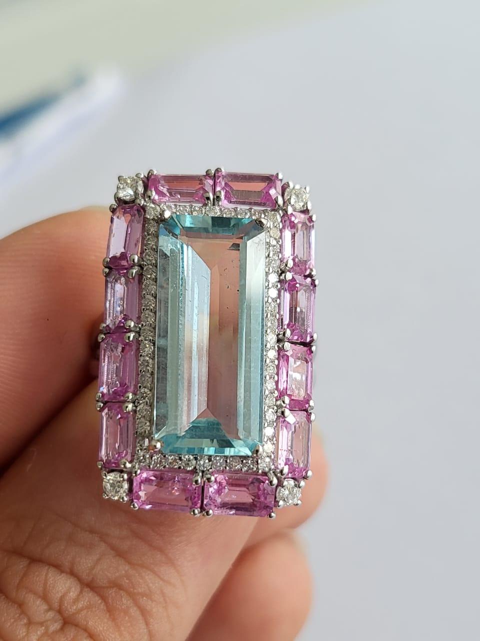 A very gorgeous and one of a kind, Aquamarine & Pink Sapphire Cocktail Ring set in 18K White Gold & Diamonds. The weight of the Aquamarine 4.45 carats. The weight of the Pink Sapphires is 3.55 carats. The Pink Sapphires are of Ceylon (Sri Lanka)