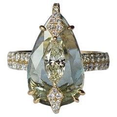 Set in 18K Gold, 4.51 carats, Aquamarine 
Marquise Diamonds Engagement Ring