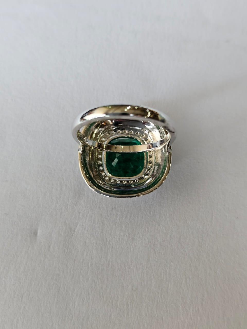 A very gorgeous and beautiful, Emerald & Black Enamel Engagement Ring set in 18K White Gold & natural Diamonds. The weight of the Emerald is 4.51 carats. The Emerald is completely natural, without any treatment. The Diamonds weight is 0.26 carats.