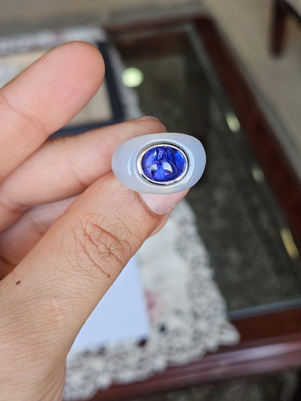 A very gorgeous and beautiful, art deco style, Tanzanite & Chalcedony Dome Cocktail Ring set in 18K White Gold. The weight of the Tanzanite Cabochon is 4.66 carats. The Tanzanite is responsibly sourced from Tanzania. The weight of the custom cut