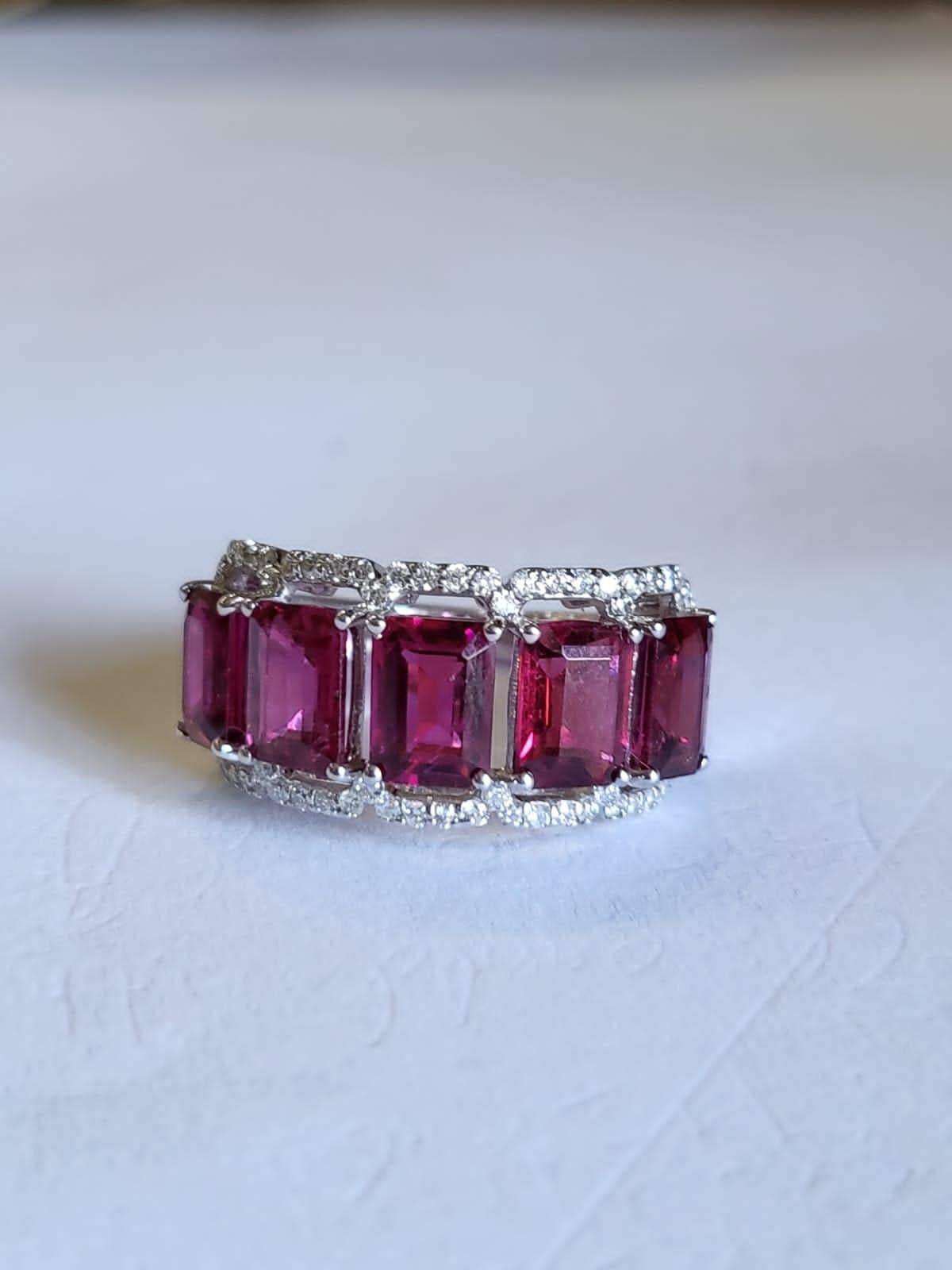 A very gorgeous and one of a kind, Rubellite Band Ring set in 18K White Gold & Diamonds. The weight of the Rubellite is 4.79 carats. The weight of the Diamonds is 0.49 carats. Net Gold weight is 5.40 grams. The dimensions of the ring are 1.10cm x