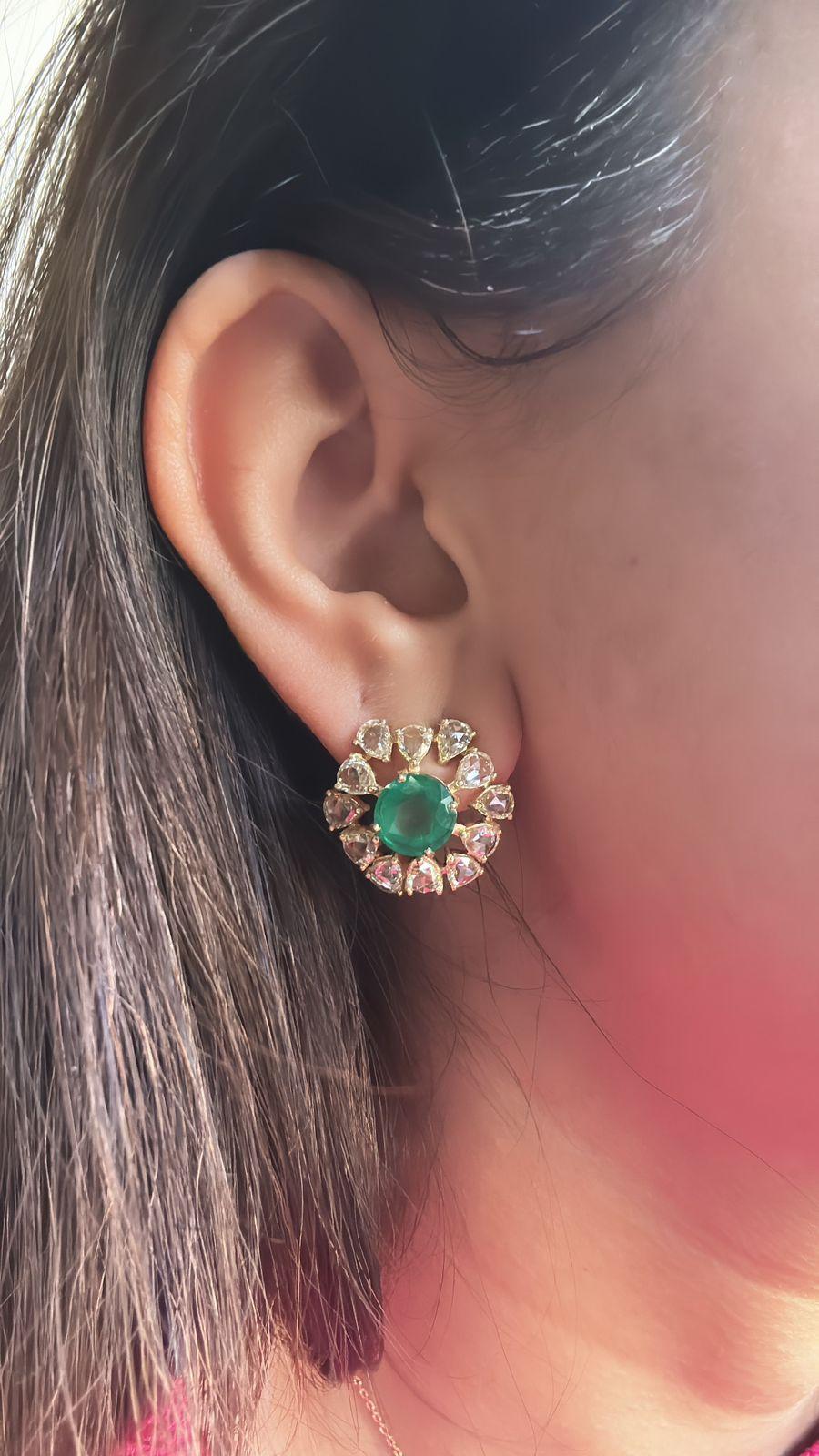 A very beautiful and special, Emerald Stud Earrings set in 18K Yellow Gold & Diamonds. The weight of the Emerald rounds is 4.86 carats. The Emeralds are completely natural, without any treatment and are of Zambian origin. The weight of the Diamonds