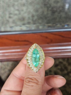 Set in 18K Gold, 4.99 carat Paraiba Tourmaline & Yellow Diamonds Engagement Ring