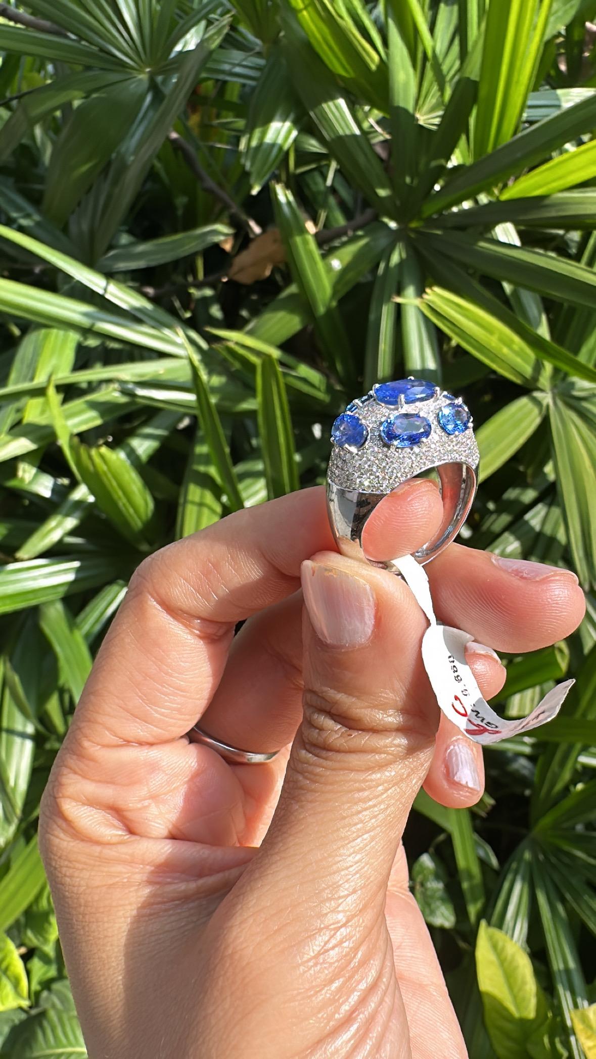 A very gorgeous and beautiful, modern style, Blue Sapphires Engagement Ring set in 18K White Gold & natural Diamonds. The weight of the Blue sapphires is 5.03 carats. The Blue Sapphires are of Ceylon (Sri Lankan) origin. The Diamonds weight is 1.32