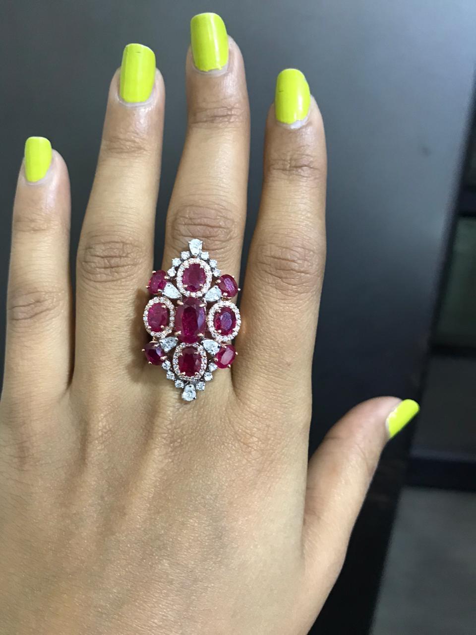 A very beautiful Mozambique Ruby & Diamonds Cocktail Ring set in 18K Rose gold. The combined weight of the Rubies is 6.10 carats. The Rubies are completely natural, no-heat and without any treatment. The Rubies originate from Mozambique, Africa. The