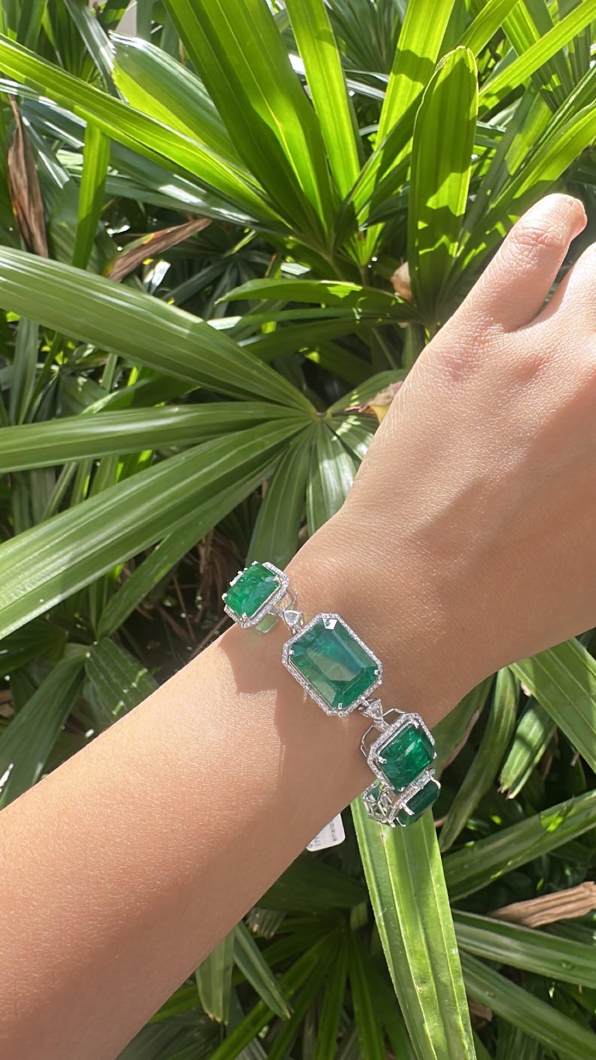 A very gorgeous and beautiful, Emerald Bracelet set in 18K White Gold & natural Diamonds. The weight of the Emeralds is 62.55 carats. The Emeralds are completely natural, without any treatment and are of Zambian origin. The combined Diamonds weight