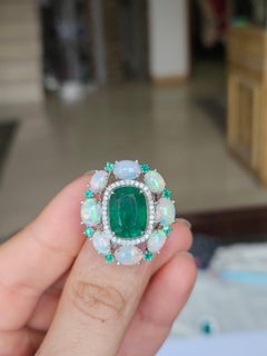 Set in 18K Gold, 6.43 carat Emeralds, Ethiopian Opal & Diamond Engagement Ring