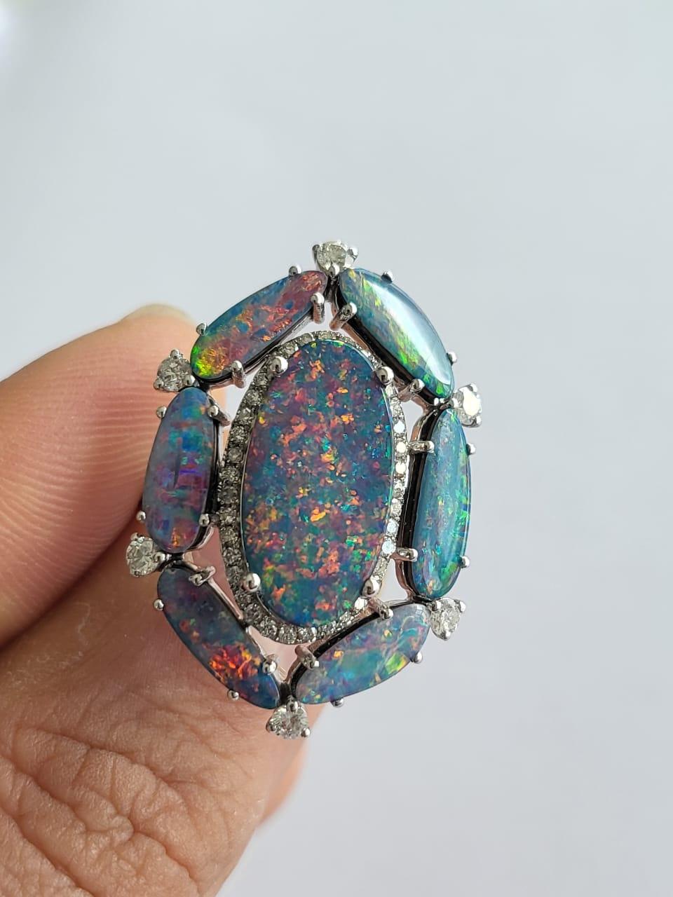 A very gorgeous and on of a kind, Doublet Opal Cocktail Ring set in 18K White Gold & Diamonds. The weight of the Australian Doublet Opals is 6.68 carats. The Diamonds weight is 0.65 carats. Net Gold weight is 6.954 grams. The dimensions of the ring