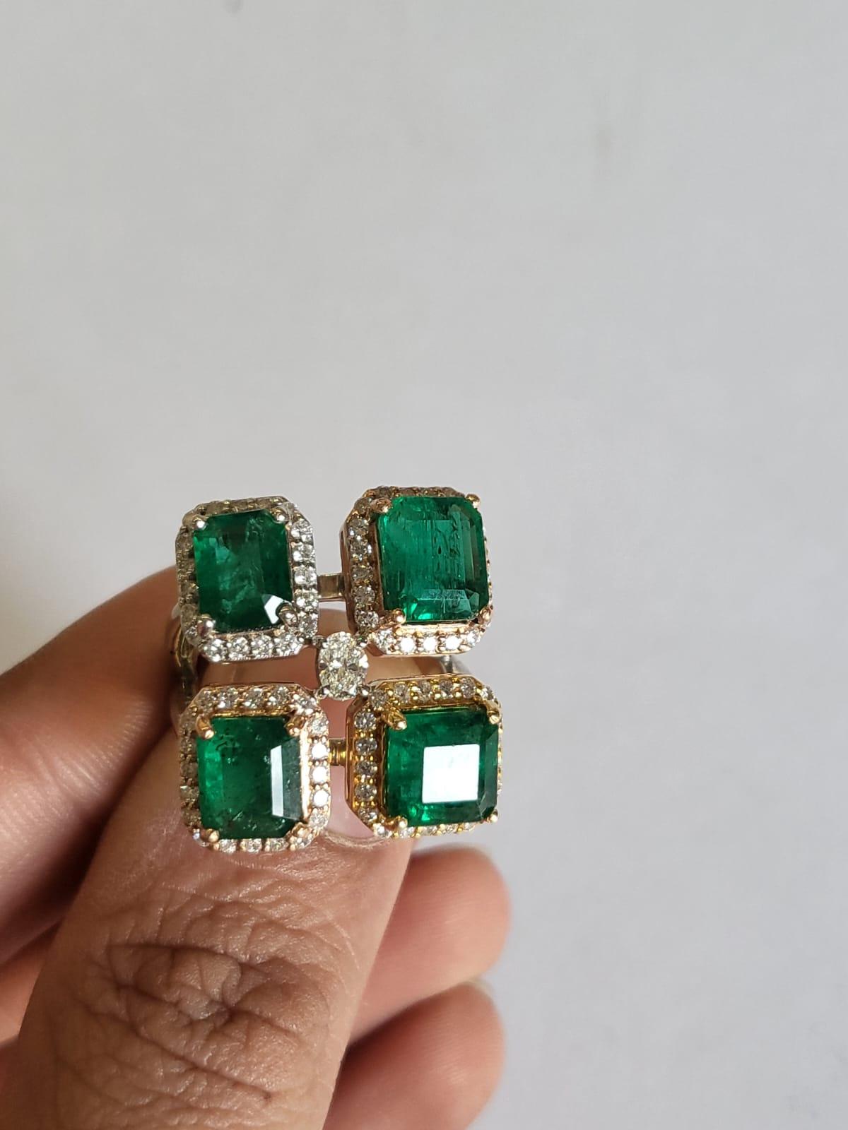 A very gorgeous and one of a kind, Emerald Cluster Ring set in 18K Rose, Yellow & White Gold & Diamonds. The weight of the Emeralds is 6.70 carats. The Emeralds are completely natural, without any treatment and is of Zambian origin. The weight of