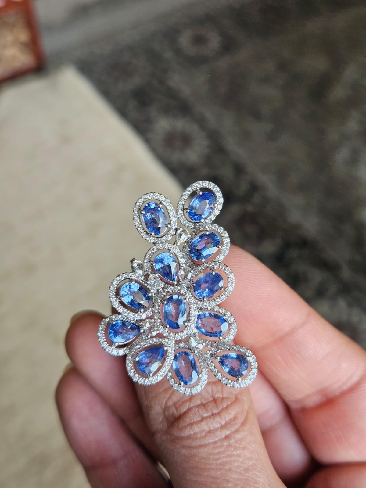A very gorgeous and beautiful, Blue Sapphire Cocktail Ring set in 18K White Gold & Diamonds. The weight of the Blue Sapphires is 6.79 carats. The Blue Sapphires are of Ceylon (Sri Lanka) origin. The combined Diamonds weight is 1.37 carats. Net 18K