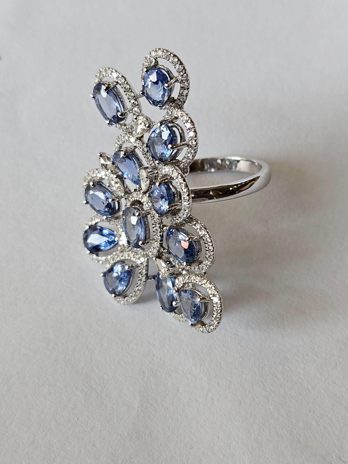 Oval Cut Set in 18K Gold, 6.79 carats Blue Sapphires & Rose Cut Diamonds Cocktail Ring For Sale