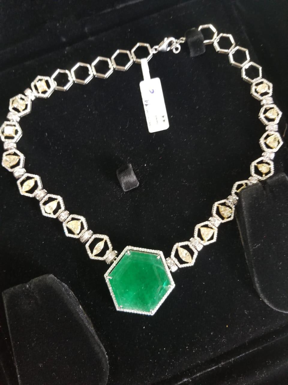 A stunning natural Zambian Emerald and Diamonds Necklace set in 18K gold. The weight of the Zambian Emerald is 70.04 carats. The Emerald is completely natural, without any treatment. The combined weight of the diamonds is 18.13 carats. The single
