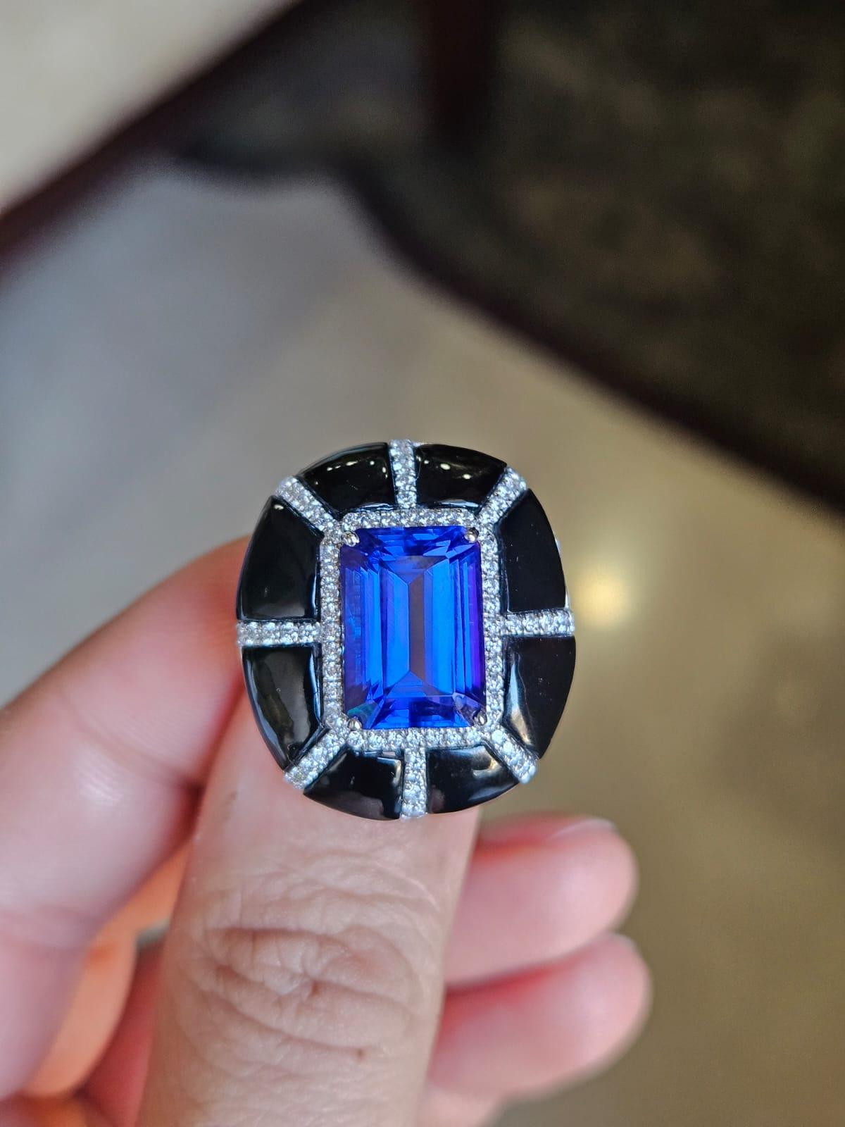 A very gorgeous and beautiful, Tanzanite & Black Onyx Cocktail Ring set in 18K White Gold & natural Diamonds. The weight of the Tanzanite is 7.33 carats. The emerald cut Tanzanite is responsibly sourced from Tanzania. The weight of the Black Onyx is
