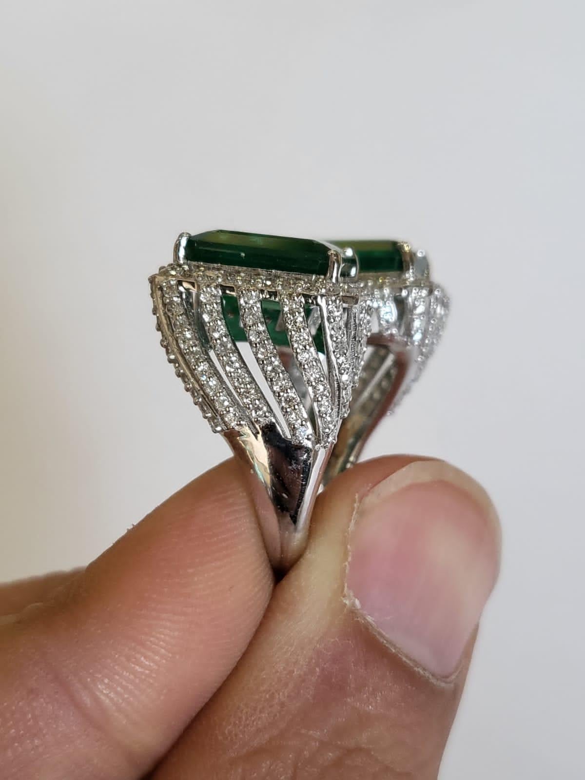 A stunning Emerald Engagement Ring set in 18K White Gold & Diamonds. The weight of the Emeralds is 7.62 carats. The Emeralds are completely natural, without any treatment and is of Zambian origin. The weight of the Diamonds is 1.46 carats. Net Gold
