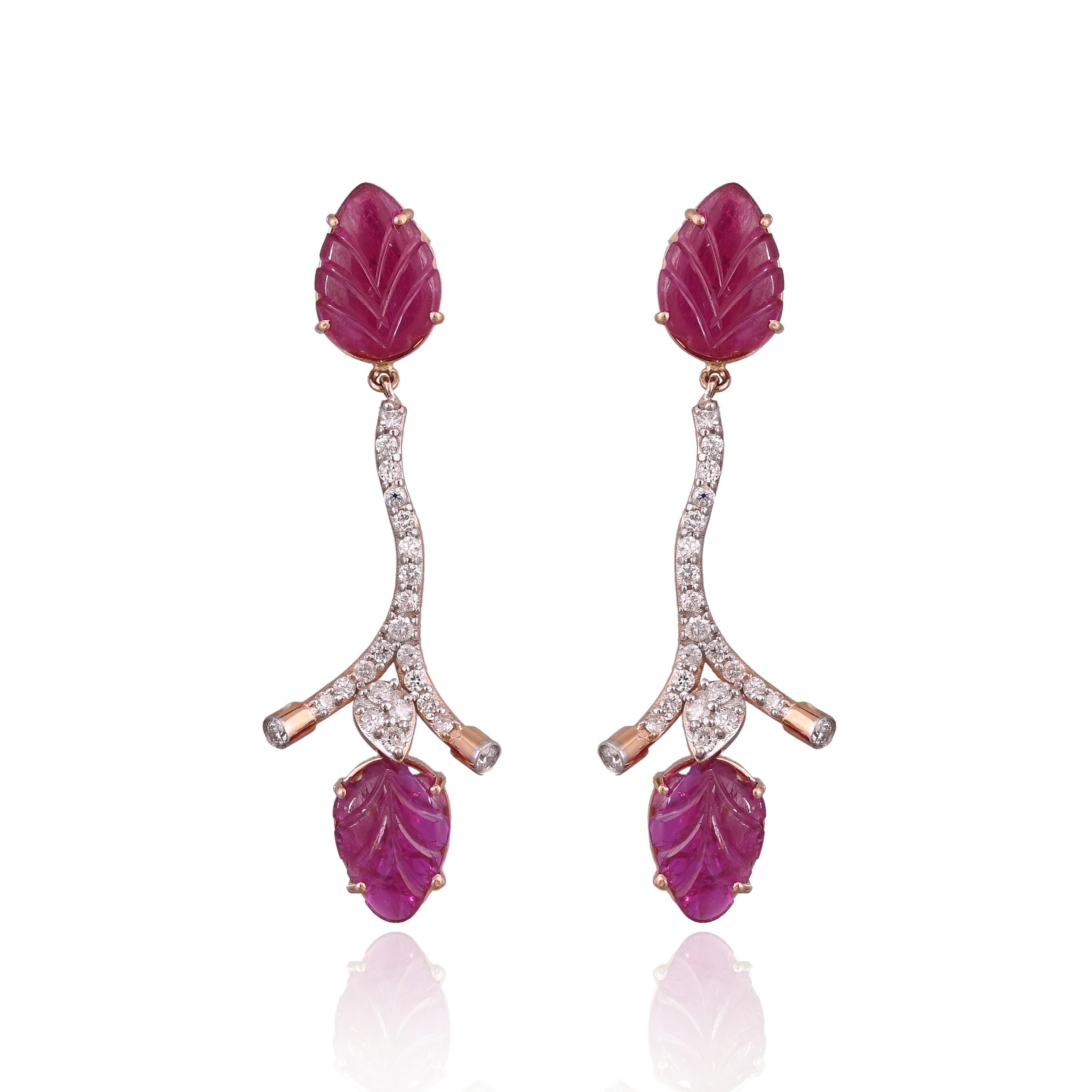 A very gorgeous and beautiful, Art-Deco style Ruby Chandelier Earrings set in 18K Yellow Gold & Diamonds. The weight of the carved Ruby is 7.75 carats. The carved Rubies are completely natural, without any treatment and are of Mozambique origin. The