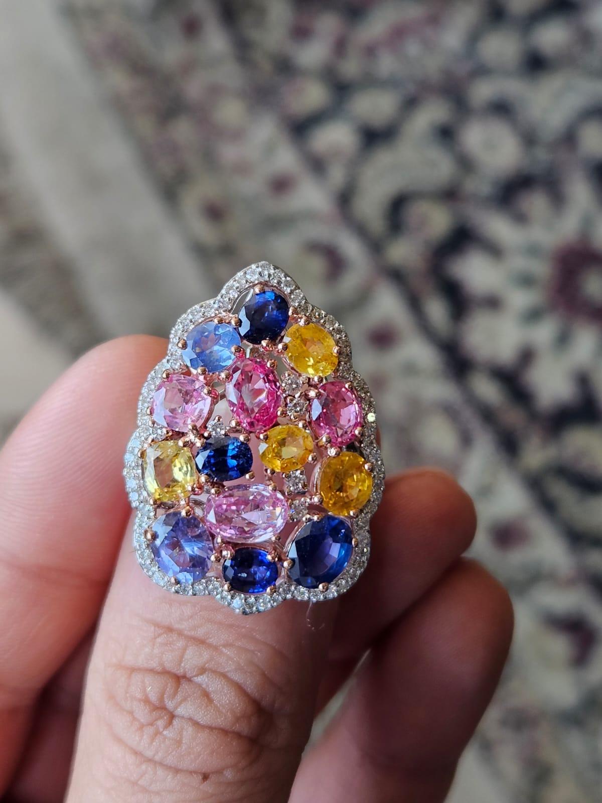 A very beautiful and chic, Multi Sapphires Cocktail Ring set in 18K White Gold & Diamonds. The weight of the Multi Sapphires is 7.90 carats. The Multi Sapphires are of Ceylon (Sri Lanka) origin. The Diamonds weight is 0.82 carats. Net 18K Gold