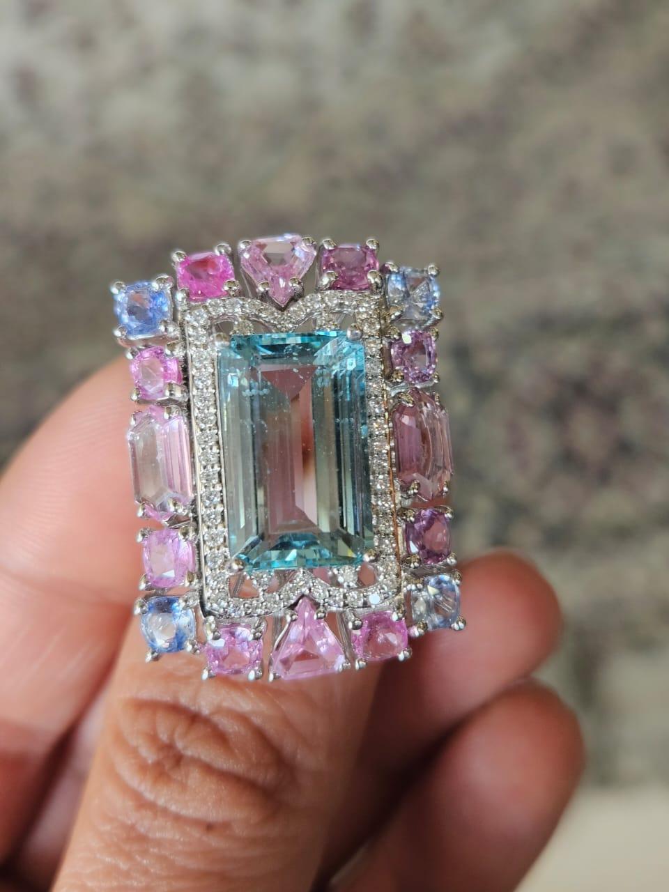 A very gorgeous and beautiful, modern style, Aquamarine & Multi Sapphires Cocktail Ring set in 18K White Gold & natural Diamonds. The weight of the Aquamarine is 7.97 carats. The weight of the Multi Sapphires is 6.11 carats. The Multi Sapphires are