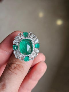 Set in 18K Gold, 8.58 carats Emerald Sugarloaf & Rose Cut Diamonds Cocktail Ring