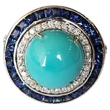 Set in 18K Gold, 8.65 carats Turquoise, Blue Sapphires & Diamonds Cocktail Ring For Sale