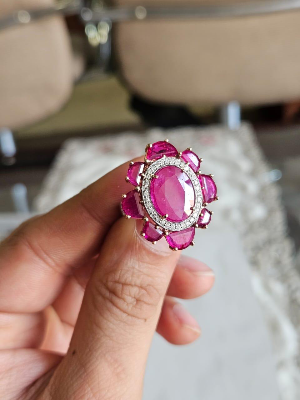 A very gorgeous and beautiful, modern style, Ruby Cocktail Ring set in 18K Gold & natural Diamonds. The combined weight of the Ruby is 8.83 carats. The Rubies are completely natural, without any treatment and are of Mozambique origin. The Diamonds