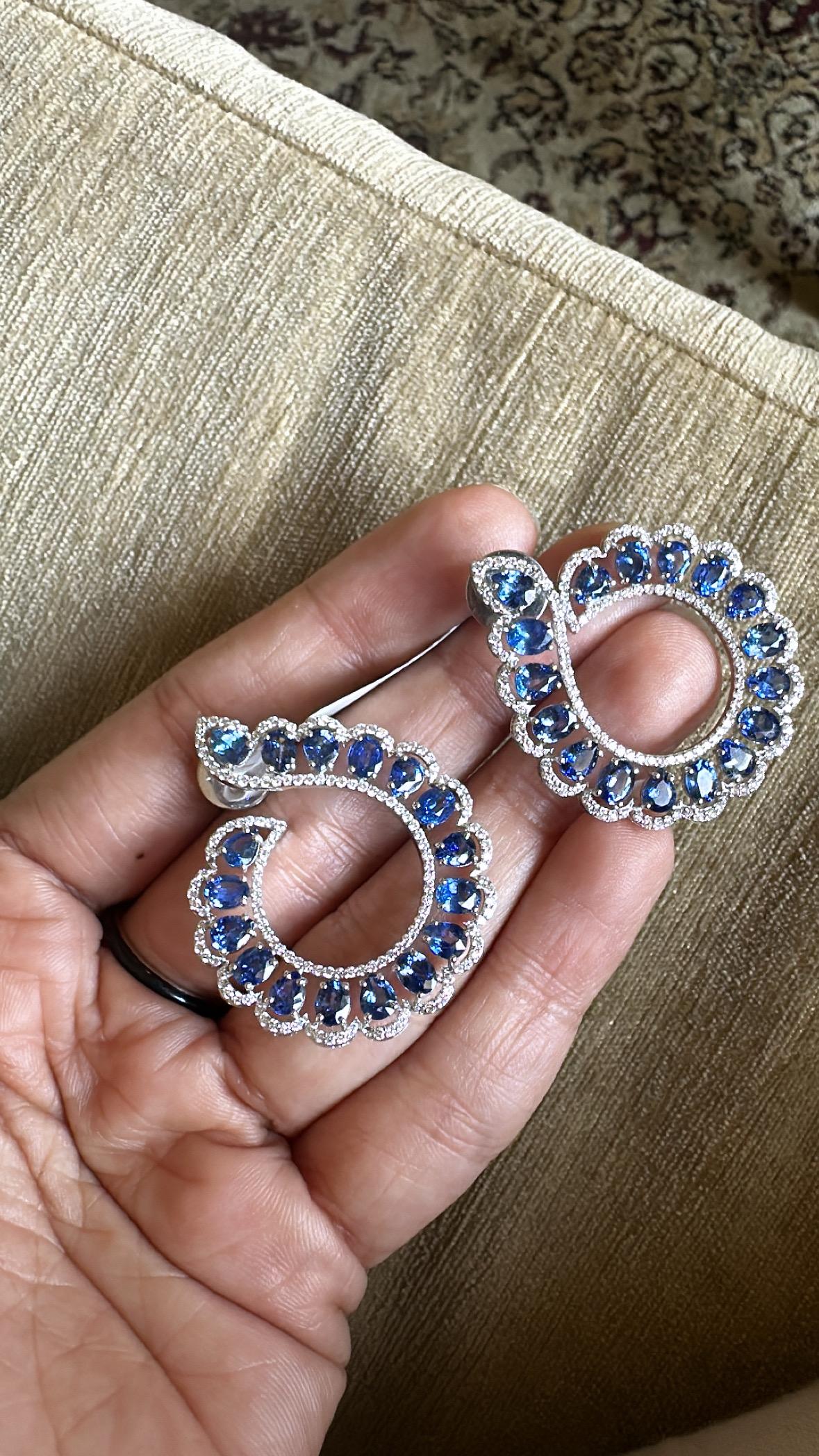 A very stunning and gorgeous, modern style, Blue Sapphire Chandelier Hoop Earrings set in 18K White Gold & natural Diamonds. The weight of the Blue Sapphires is 9.02 carats. The Blue Sapphires are of Ceylon (Sri Lankan) origin. The Diamonds weight