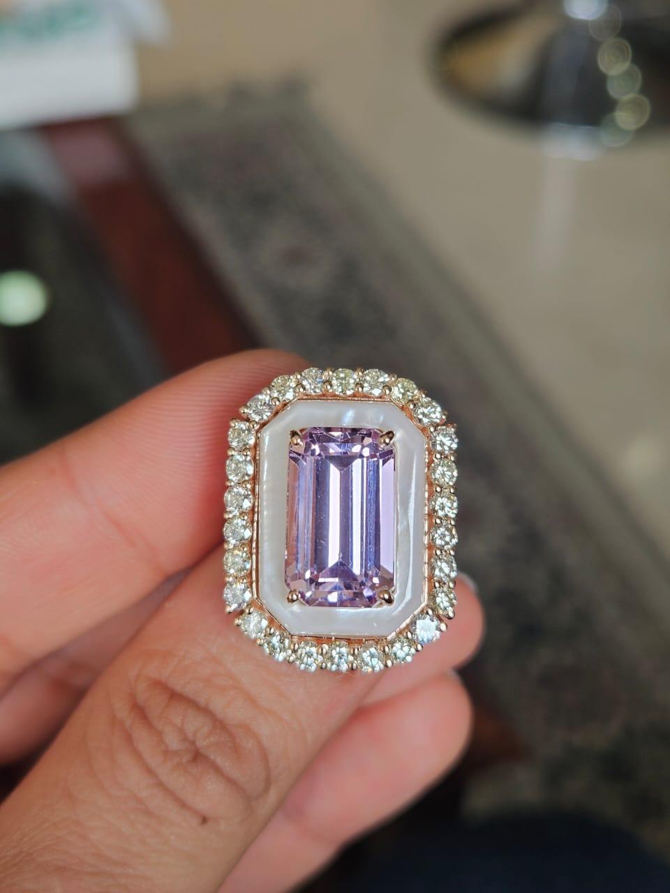 A very gorgeous and beautiful, Kunzite & Mother of Pearl Engagement Ring set in 18K Rose Gold &b natural Diamonds. The weight of the Kunzite is 9.08 carats. The weight of the Mother of Pearl is 4.53 carats. The Diamonds weight is 1.75 carats. 18K