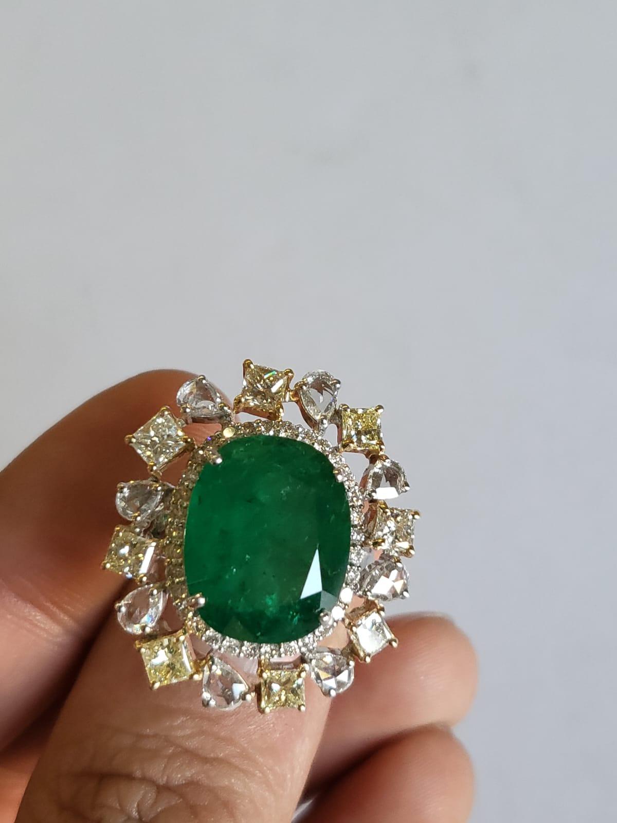  A very gorgeous and beautiful Emerald Engagement / Cocktail Ring set in 18K White Gold & Diamonds. The weight of the Emerald is 9.48 carats. The Emerald is completely natural, without any treatment and is of Zambian origin. The combined weight of