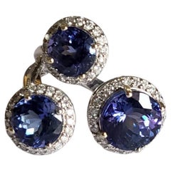 Set in 18K Gold, 9.16 carats Tanzanite & Diamonds Cocktail / Three stone Ring