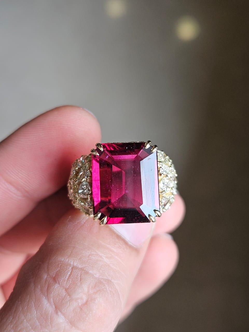 A very gorgeous and beautiful, modern style Rubellite Engagement Cocktail Ring set in 18K Yellow Gold & natural Diamonds. The weight of the Rubellite is 9.17 carats. The combined weight of Diamonds is 3.53 carats. Net 18K Yellow Gold weight is 7.80