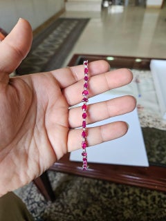 Set in 18K Gold, 9.57 carats, natural Mozambique Ruby & Diamonds Tennis Bracelet