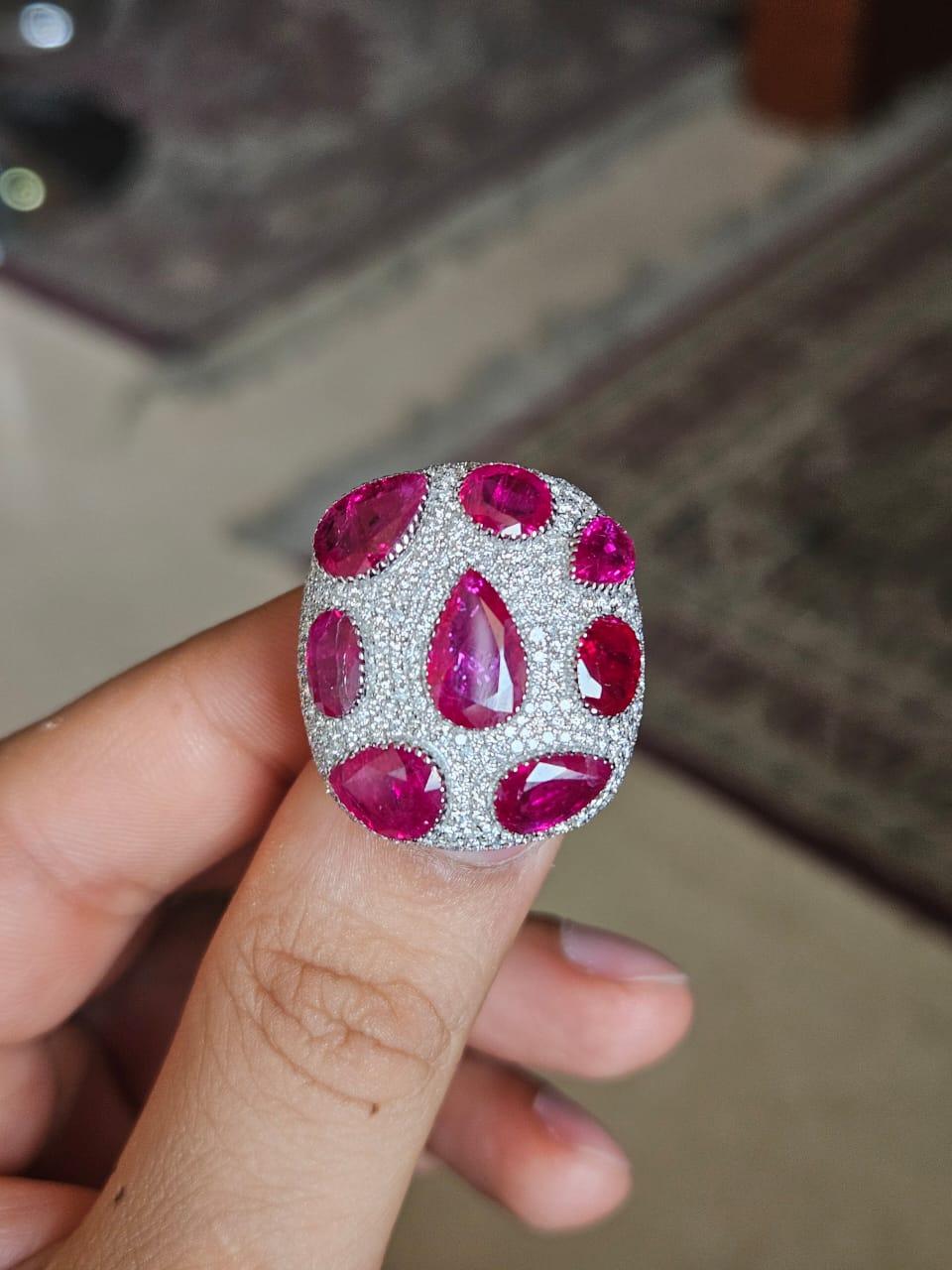 A very gorgeous and beautiful, modern style, Ruby Cocktail Ring set in 18K White Gold & natural Diamonds. The weight of the Rubies is 9.63 carats. The Rubies are completely natural, without any treatment & is of Mozambique origin. The Diamonds