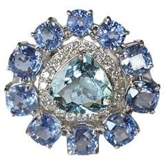 Set in 18K Gold, Aquamarine, Blue Sapphires 
Diamonds Cocktail Engagement Ring