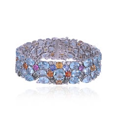 Set in 18K Gold, Aquamarines, Ceylon Multi Sapphires & Diamonds modern Bracelet