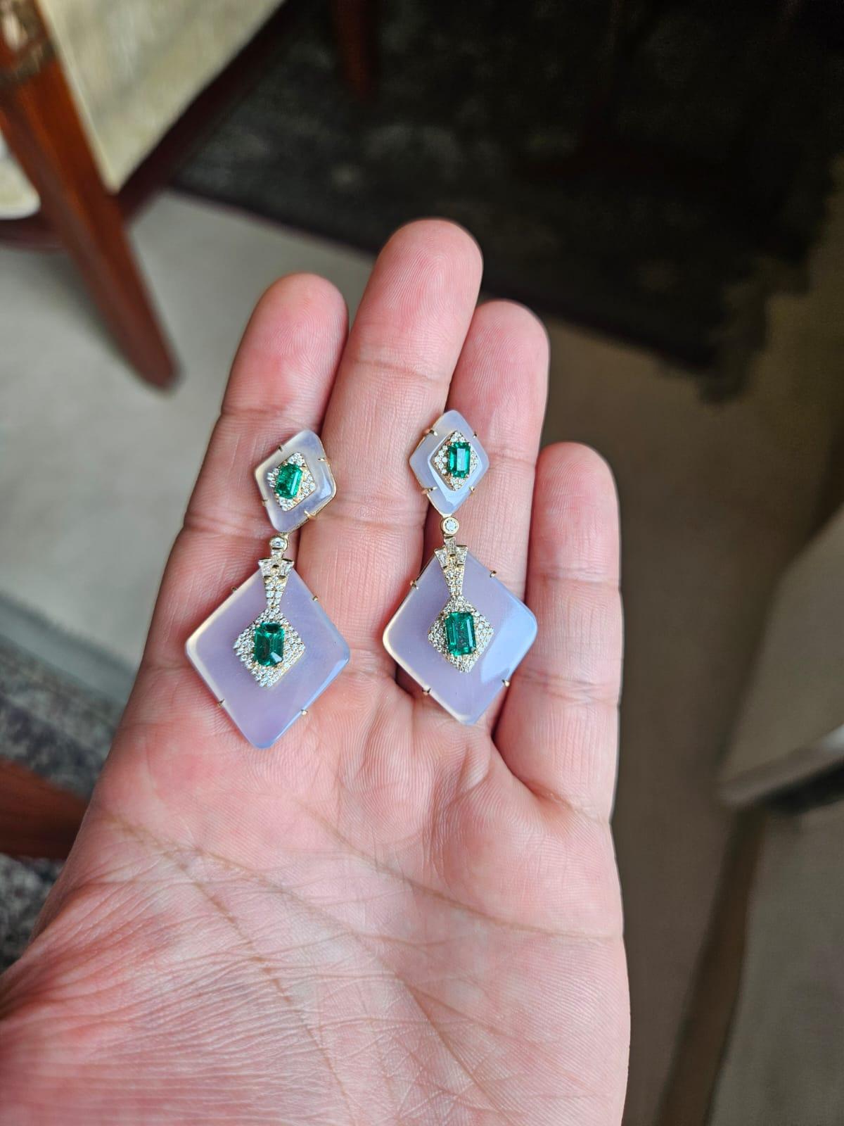 A very gorgeous and beautiful, one of a kind, art deco style, Emerald and Rock Crystal Dangle Earrings set in 18K Yellow Gold & natural Diamonds. The weight of the Emeralds is 1.97 carats. The Emeralds are completely natural, without any treatment