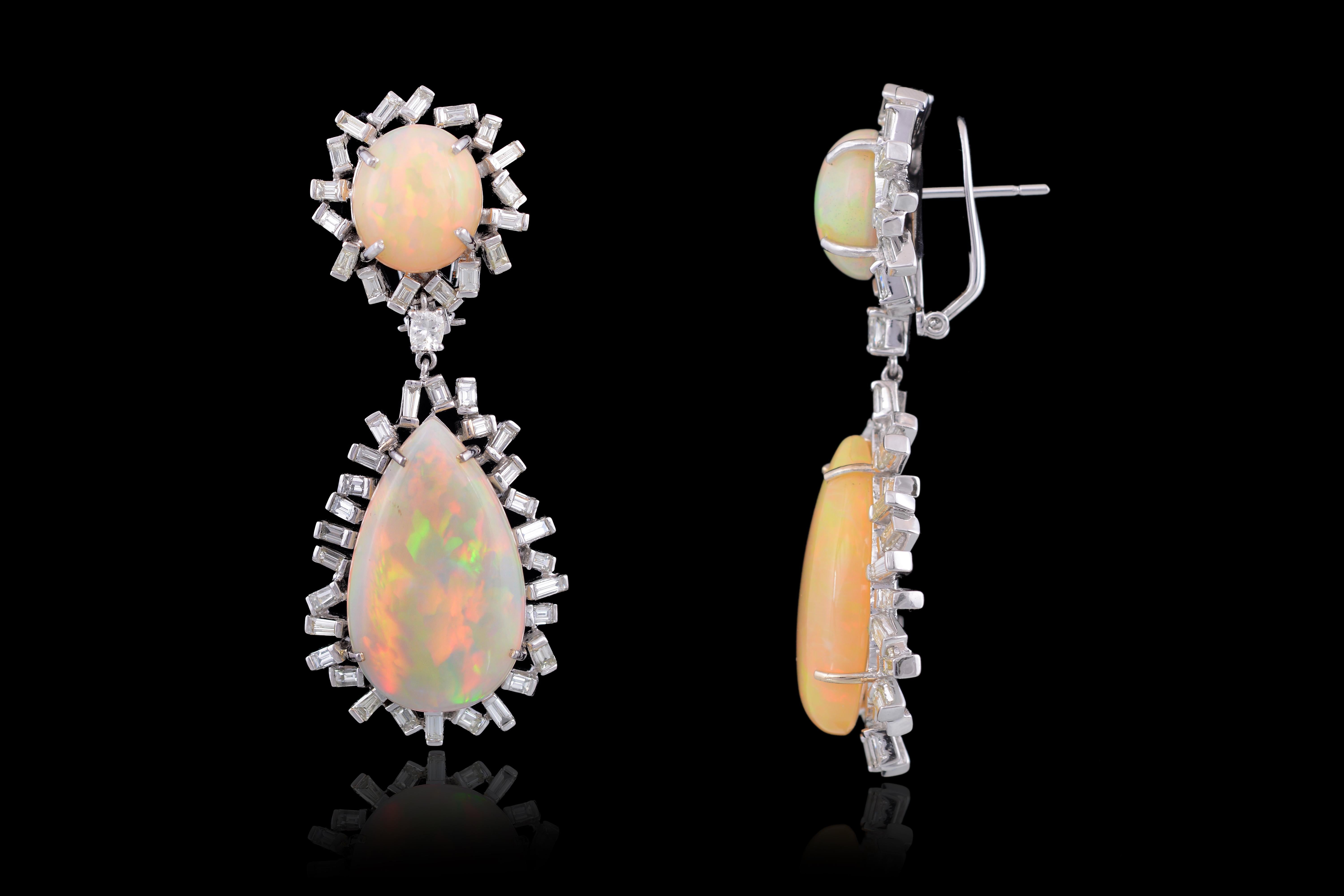 Gorgeous Ethiopian mix and match earrings set in 18K white gold with baguette diamonds set in 18K white gold. The earrings are made in art deco style with a mix and match concept. The total weight of opals is 41.92 carats, whereas the diamonds weigh