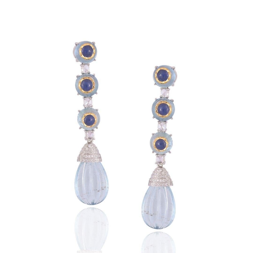 A very unique piece of chandelier drop earrings set in 18K gold & Diamonds. The top of the earring, Blue sapphire in-laid on Aquamarine bead set in 22K yellow Gold for safety and so it doesn't come out. Both the Aquamarines & Blue Sapphires are