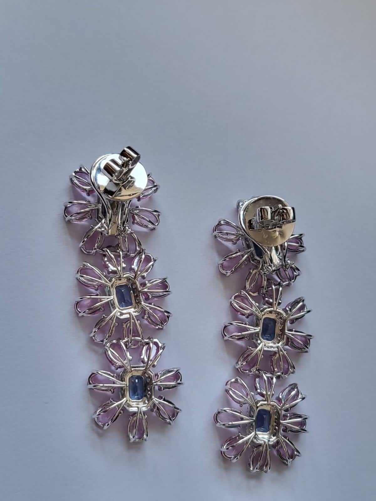A very gorgeous and one of a kind, Blue Sapphire & Pink Sapphire Chandelier Earrings set in 18K White Gold & Diamonds. The weight of the Blue Sapphires is 4.36 carats. The Blue Sapphire is of Ceylon (Sri Lanka) origin. The weight of the Pink
