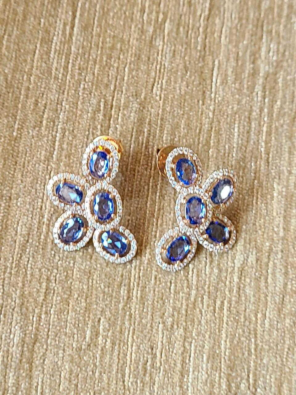 A very gorgeous and dainty pair of Blue Sapphire Earrings set in 18K Gold & Diamonds. The weight of the Blue Sapphires is 4.37 carats. The Blue Sapphires are of Ceylon (Sri Lankan) origin. The weight of the Diamonds is 1.02 carats. Net Gold weight