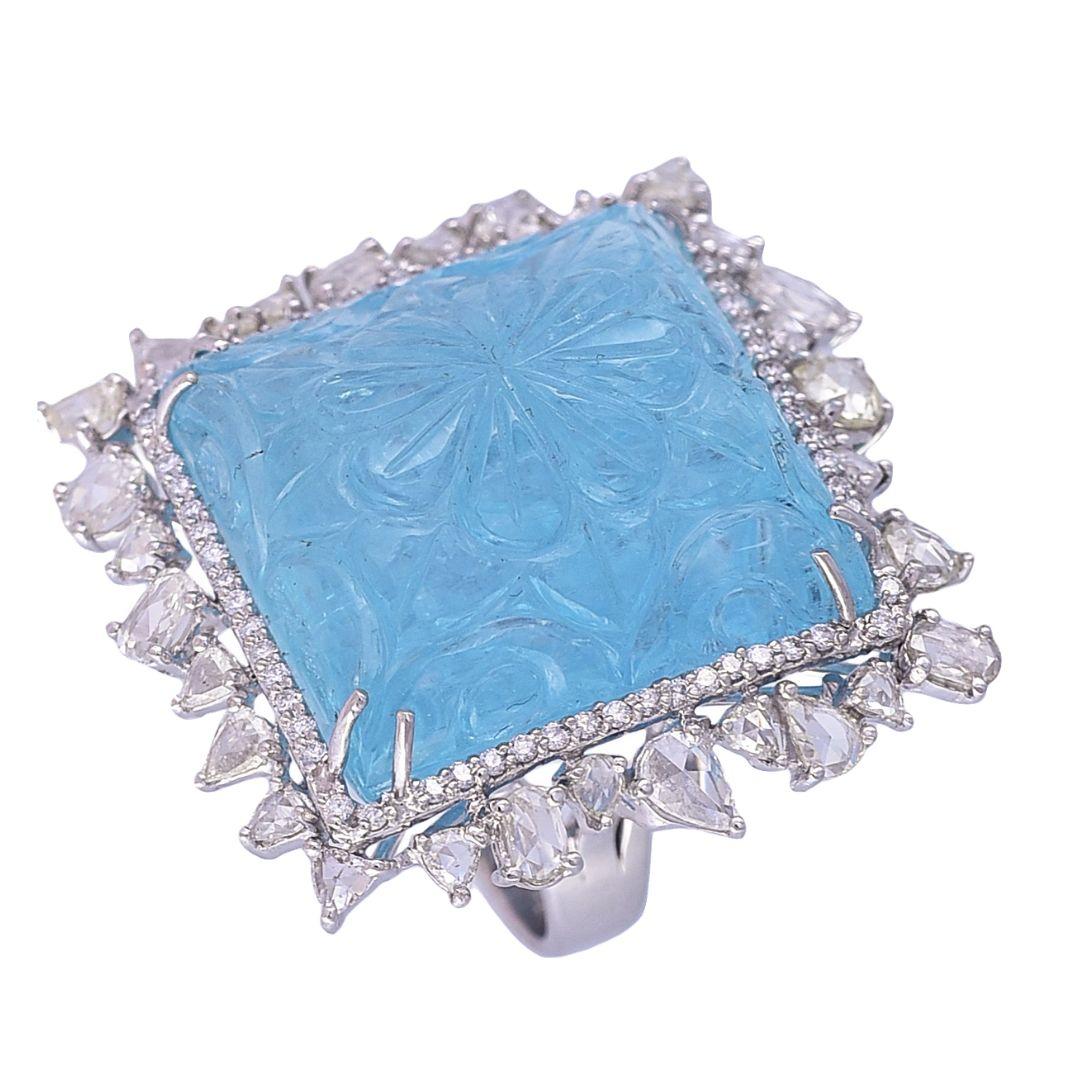 A gorgeous, one of a kind carved Aquamarine & Rose Cut Diamonds Cocktail Ring set in 18K White Gold. The Aquamarine is hand-carved, is completely natural without any treatment. The Aquamarine is cut, polished and carved in our very own workshop in