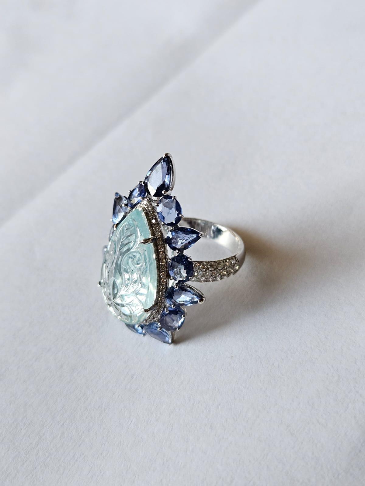 Modern Set in 18K Gold, carved Aquamarine, Blue Sapphires & Diamonds Cocktail Ring For Sale