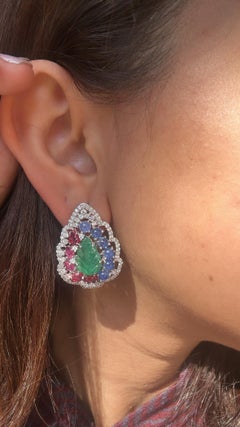 Set in 18K Gold, carved Emerald, Blue Sapphire, Ruby & Diamonds Stud Earrings
