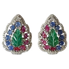 Set in 18K Gold, carved Emerald, Blue Sapphire, Ruby & Diamonds Stud Earrings