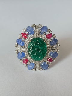 Set in 18K Gold, carved Emerald, Blue Sapphires, Rubies & Diamonds Cocktail Ring