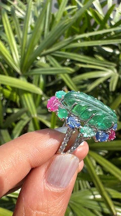 Set in 18K Gold, carved Emerald, Blue Sapphires, Ruby & Diamonds Cocktail Ring