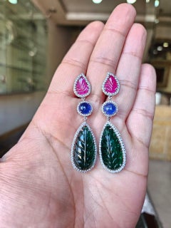 Set in 18K Gold, carved Emerald, Ruby, Blue Sapphires & Diamonds Dangle Earrings