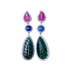 Set in 18K Gold, carved Emerald, Ruby, Blue Sapphires & Diamonds Dangle Earrings