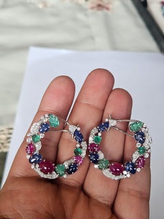 Set in 18K Gold, carved Emeralds, Blue Sapphires, Ruby & Diamonds Hoop Earrings