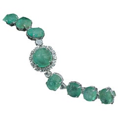 Set in 18K gold, carved, Russian Emerald and Rose cut Diamond art deco bracelet Set in 18K gold, carved, Russian Emerald and Rose cut Diamond art deco bracelet