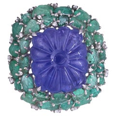 Set in 18K Gold. carved Tanzanite, Zambian Emeralds & Diamonds Cocktail Ring